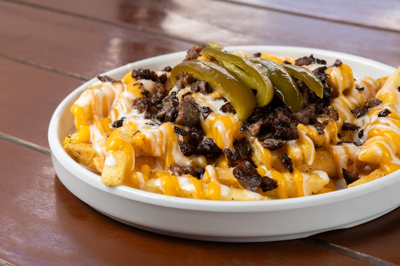 Loaded Snob Fries with cheese and jalapeños